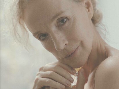 A woman ageing and noticing the impact of time on her face