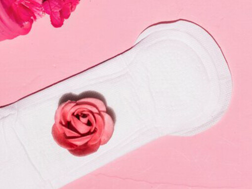 Top view of menstrual essentials: pads, tampons, and pain relief items for period care