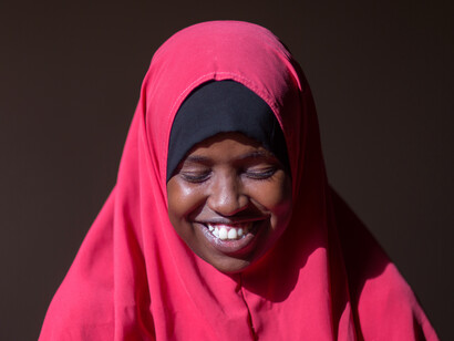 In the heart of the social media boom, this Somali woman’s radiant smile reflects the optimism and excitement of a community that is leveraging digital platforms to connect, create, and thrive