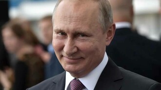 Russian President Vladimir Putin smiling even though he is at war with Ukraine