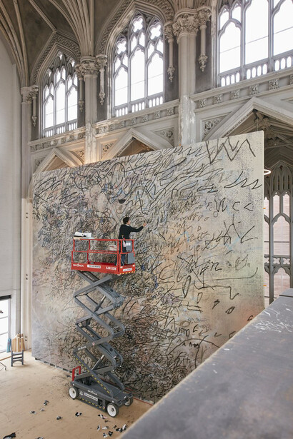 Julie Mehretu at work; courtesy the artist and Marian Goodman Gallery; © Julie Mehretu; photo: Tom Powel Imaging, Inc.