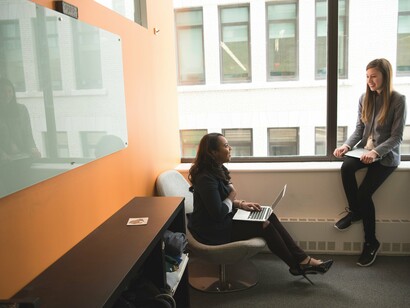 Two women sitting talking