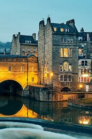 Pulteney Bridge, spanning the River Avon in Bath, England, was completed in 1774 to connect the city with Bathwick, an area the Pulteney family sought to develop. Designed by Robert Adam, the bridge is a striking example of Palladian style