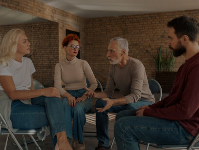 A psychological therapy support group meeting fostering a supportive mental health community