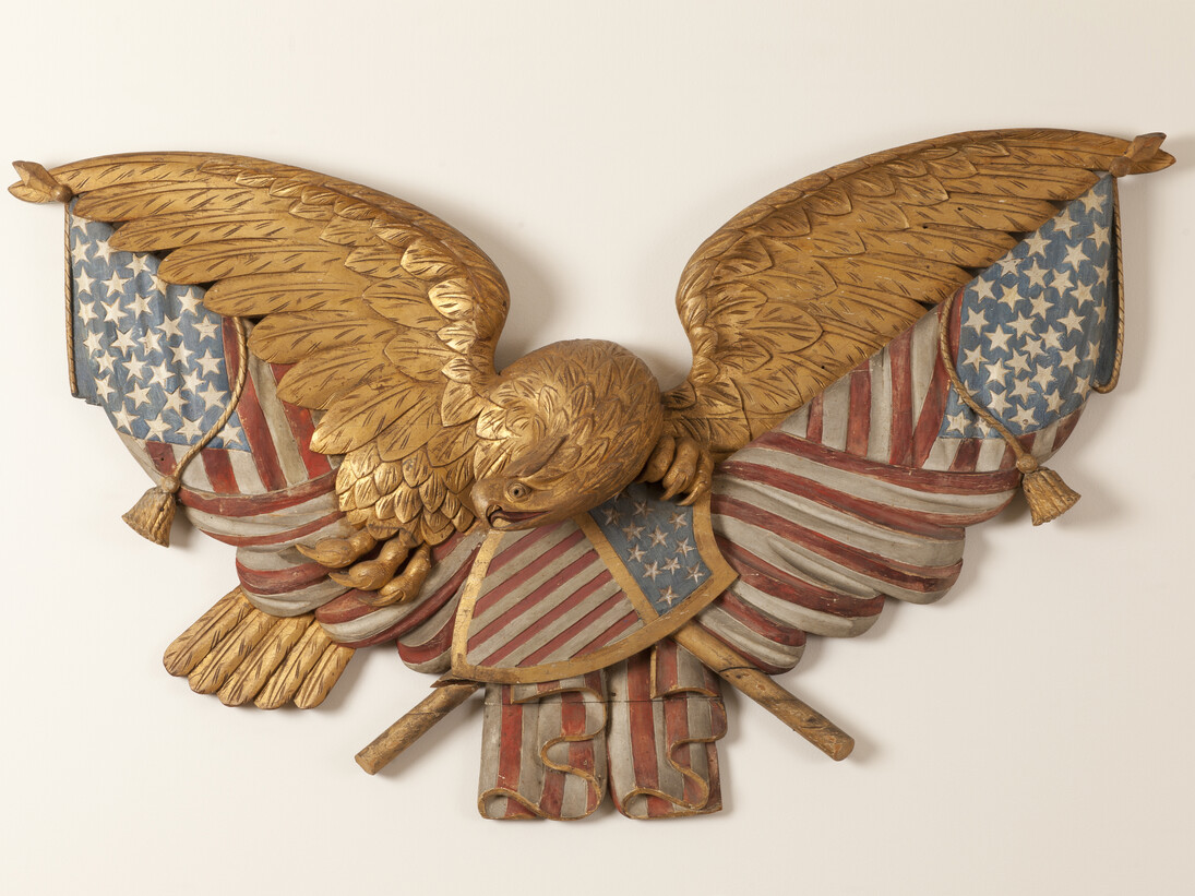 Eagle and Flags Plaque, Artist unidentified, Probably New England, 1875–1900, Paint, and gilt on white pine, 32 x 48 x 6". Photo courtesy of the Barbara L. Gordon Collection