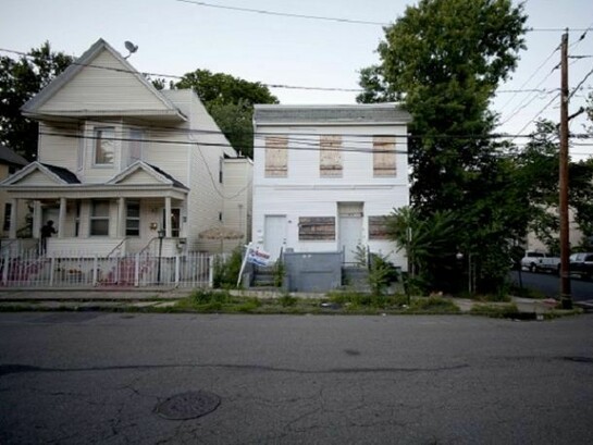 Street view of residences in Orange, New Jersey (by MOS Architects and team, assigned to The Oranges). Photograph courtesy of MOS Architects.