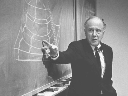 John Archibald Wheeler was an American theoretical physicist and is explaining complex theories to eager students