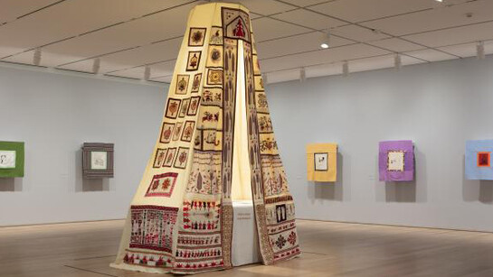 Mounira Al Solh, Sperveri, 2017 (front), embroidery and mixed media on linen and cotton, various dimensions and My speciality was to make a peasants’ haircut, but they obliged me work till midnight often, 2014–2017 (back), textile collages with hand- and machine stitched embroidery and mixed media, various dimensions. Installation photograph of Mounira Al Solh: I strongly believe in our right to be frivolous, February 8 - April 29, 2018, Art Institute of Chicago. Image courtesy of the Art Institute of Chicago.