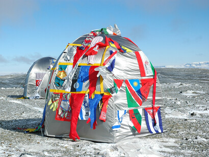 Window on the World - Antarctica, 2007
Diptych window frames, Lambda photograph laminated, mirror, glass, 38 plasma bottles, used clothes, flags, copper pipes, 2 taps, 105 x 17 x 134 cm
Courtesy of the artists. Photo: Bertrand Huet
