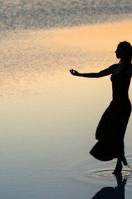 Woman peacefully walking across the water