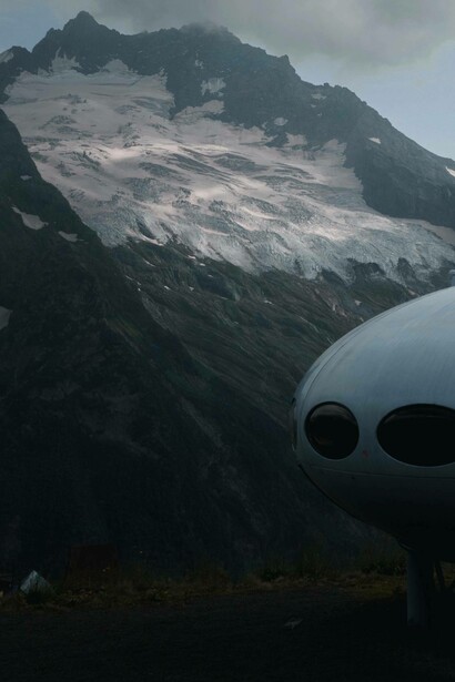 UFO shaped hotel pod with view of mountain