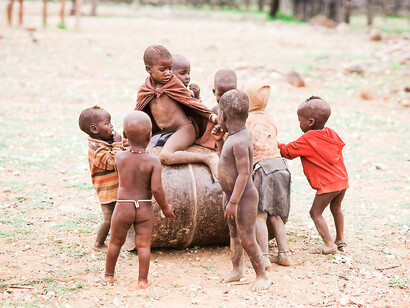 Namibian kids playing. When things played simpler in life, a great joy filled the world. We would jolt consistently as mischief youths through the town and leave the wake of our laughter in the streets