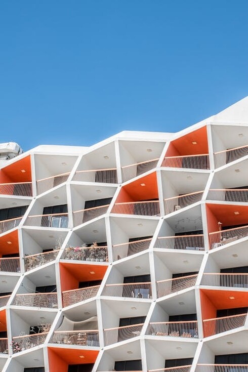 A minimalist-designed orange building with sleek balconies in Dubai, United Arab Emirates