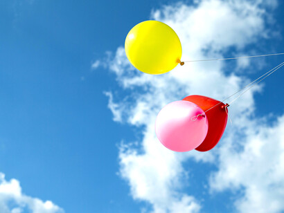 Balloons flying against the sky