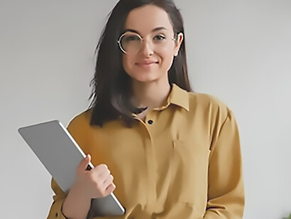A young businesswoman reviewing data on her tablet