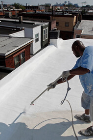 Painting a New York City rooftop with reflective paint fights heat