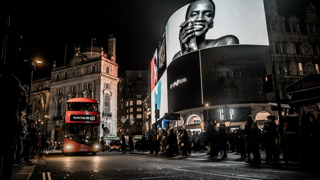 Advertising boards in London, England at night 