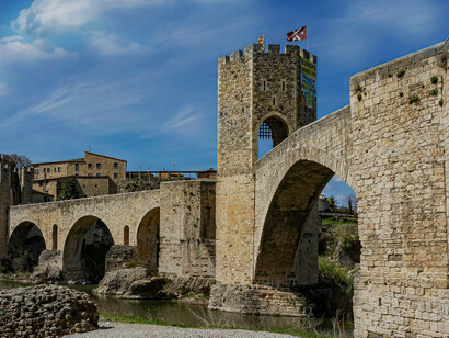 The ancient bridge in Besalú, nestled in the heart of Catalonia, beautifully captures the essence of the town’s medieval charm