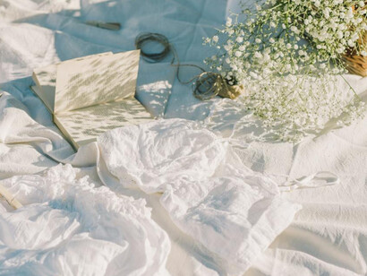 Soft fabrics and scattered memories evoke the quiet beauty of imagined journeys