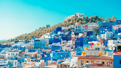 The iconic blue houses of Morocco, representing a country moving forward with confidence and stability