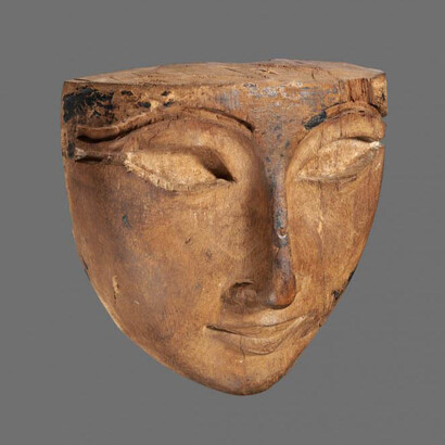 Wooden mummy mask with inlaid eyes. Egypt, New Kingdom, 18th Dynasty, 1540 to 1295 BCE. 13.35 x 12.98 x 7.2 cm. The al-Sabah Collection, Dar al-Athar al-Islamiyyah, Kuwait. 