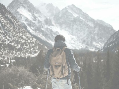 A skier takes a moment to reflect on the total encompassing nature and function of being