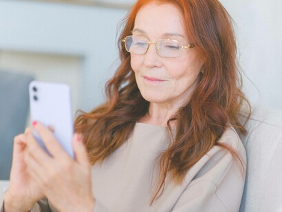 Woman going through old photographs