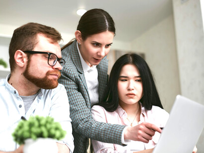 During a meeting, a financial advisor guides a family as they discuss notes and consider their investment options