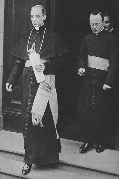 Nuncio Eugenio Pacelli—who would later become Pius XII—standing with Father Leiber after the signing of the Prussian Concordat