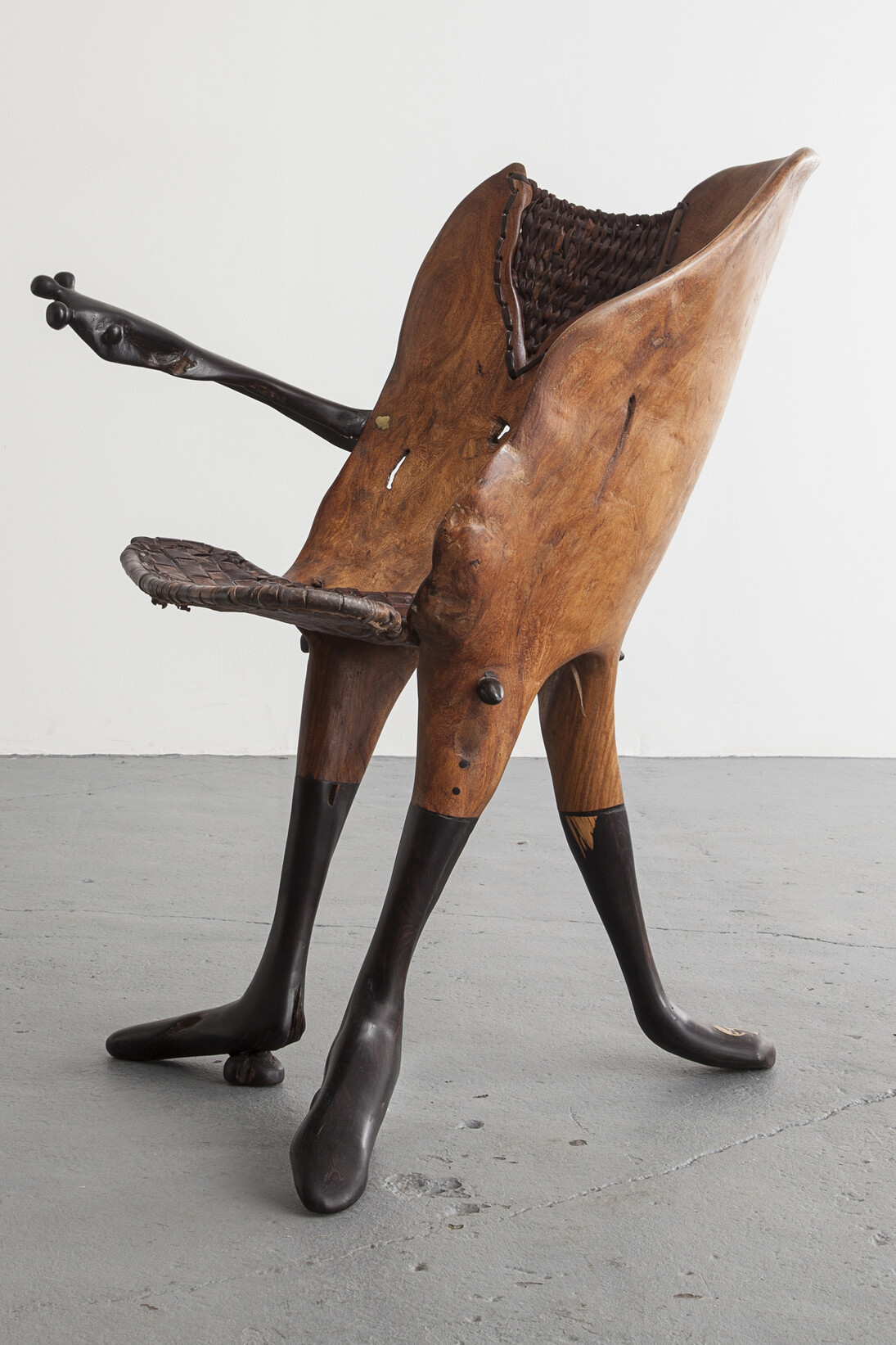 Sculptural "Peau Tendre" chair in ebony and leather. Designed by Babacar Niang, Senegal, 2013. 15.75" L x 29.92" W x 29.53" H / 40cm L x 76cm W x 75cm H. Photo by Joe Kramm/R & Company