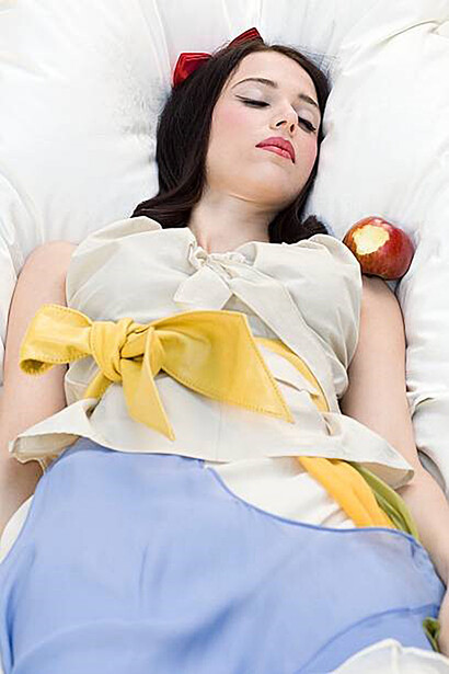 Snow White, ensnared in slumber, succumbs after consuming the poisoned apple