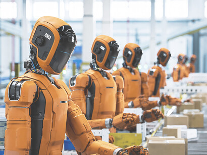 Autonomous AI-powered humanoid robot sorting packages and moving boxes in a modern fulfillment center, showcasing the future of warehouse automation and logistic