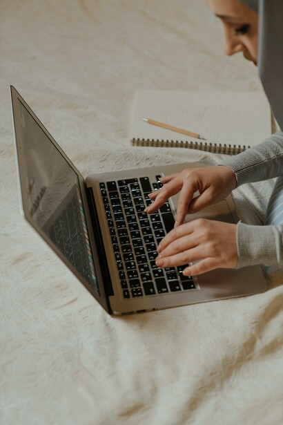 Woman typing on her laptop