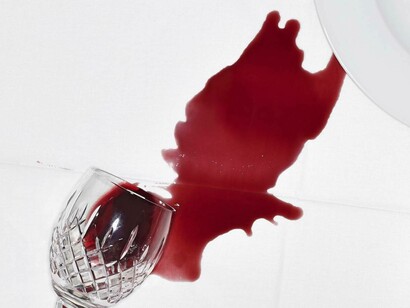 A tablecloth remembers the wine spill even after it is washed