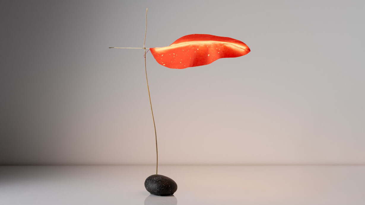 Jake Coan, Touchstone Leaf, 2023. Stone from Little Cranberry Island, ME, touch sensor, brass tube/rod, wire, LED filament, paper, 21" H. Courtesy of the artist and Hostler Burrows Gallery