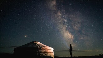A lonely man beside a tent