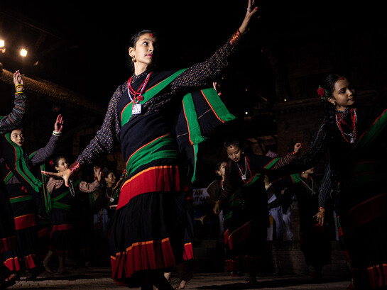 Members of the Newar community perform a traditional dance at Patan Durbar Square during the Lalit Carnival, celebrating World Tourism Day