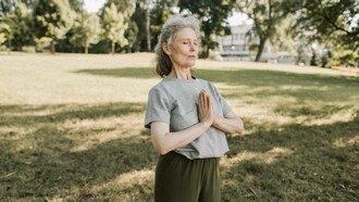 Woman breathing in a meditative pose