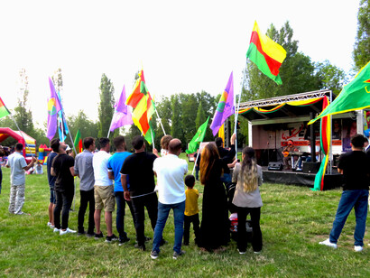 Flags of Kurdish freedom movement at a festival in Kassel, Germany, July 2023 @ Ashish Kothari