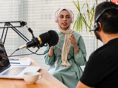 Within the realm of cultural exchange, the live podcast show orchestrates an engaging dialogue, hosting an interview and thought-provoking discussion between a perceptive blogger and a Muslim woman guest