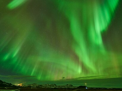 Spectacular northern lights illuminating the skies above Reykjahlíð, Þingeyjarsveit