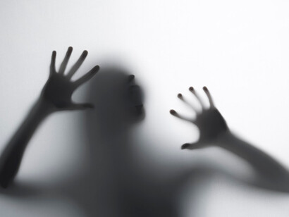A shadow trying to escape the abuse and pain of domestic violence