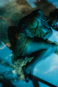 Woman in a dress lying beneath the water’s surface