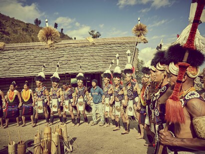 People wearing the traditional tribal dress of India's North East @TUTC