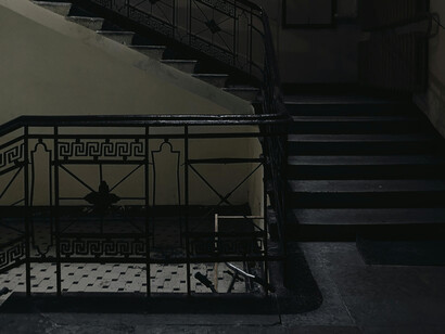 An old stairwell, dark and dusty liminal space