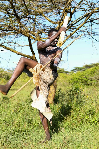 Tribal man dancing with body art