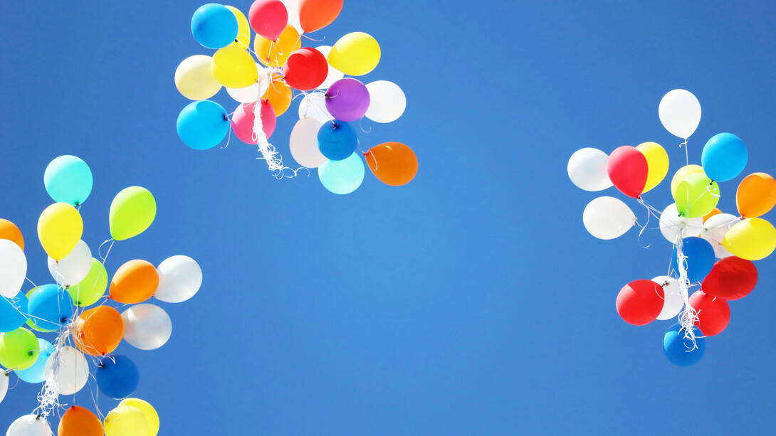 Balloons finding their way upwards, not held down by unnecessary burden