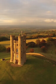 A white castle captured in photography, with Broadway Tower bathed in the soft, fading autumn sunshine late in the day. Broadway Tower & Country Park, Broadway, United Kingdom