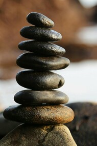 A serene stack of balanced stones symbolizes the art of focus and mindfulness
