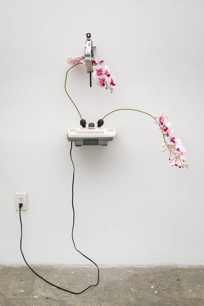 Rachel Youn, Sexy but not joyous, 2022. Shiatsu massager, artificial flowers, broken tire jack, 30 x 32 x 22.5 in. Courtesy of Sargent's Daughters Gallery